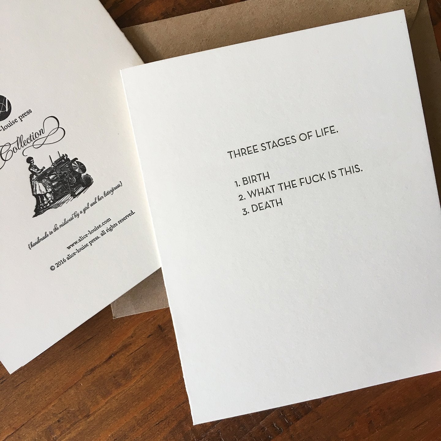 White printed card, black type: "Three Stages of Life" with birth and death.