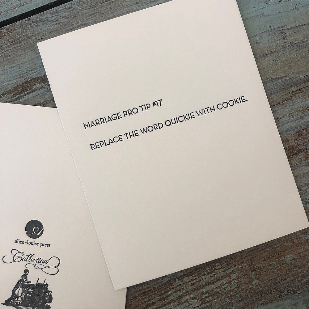 White greeting card with “Replace the word quickie with cookie” printed text.