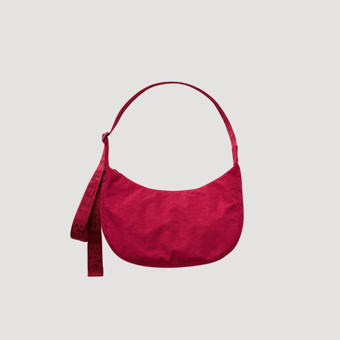 Medium nylon crescent bag in deep red with top handle and side zipper