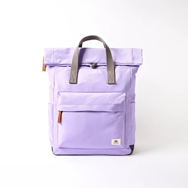 Medium nylon backpack, lavender with front flap pocket and top handles.