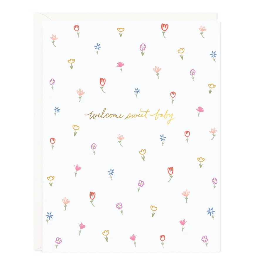 Floral baby blanket with colorful tulip icons and "welcome sweet baby" print