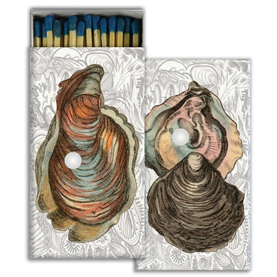 Decorative matchbooks with two illustrated faces and patterned paper wrappers