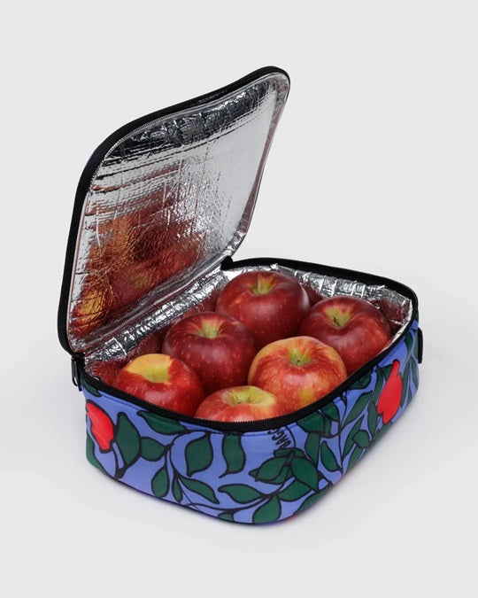 Open blue floral lunch bag with foil-lined interior and apples inside, carry strap.
