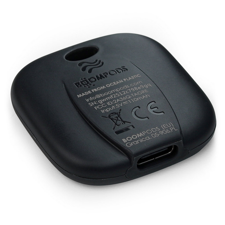 Dark key finder tag base with charging port and printed label details