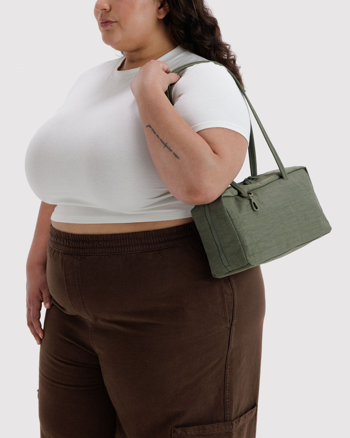 Olive green nylon bowler bag, top handles and front zip pocket