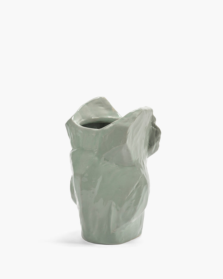 Glazed light gray owl vase, rear view with open top and textured surface