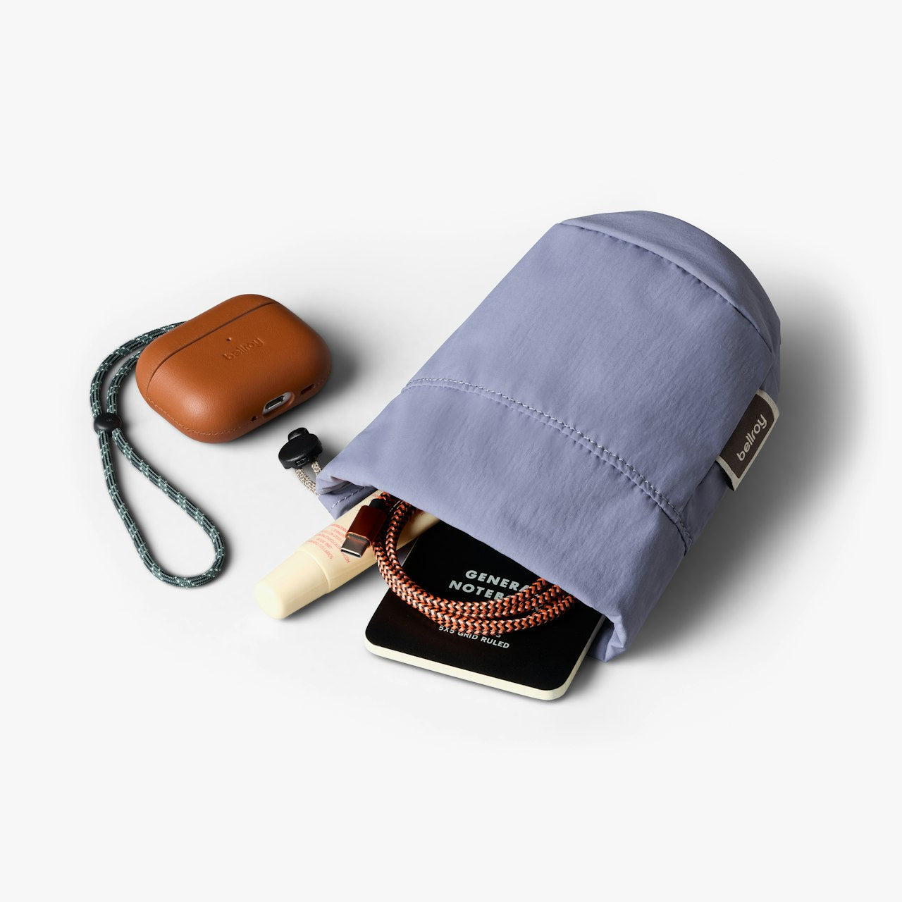 Lilac cinch pouch with carabiner clip, braided rope drawcord, and fabric label