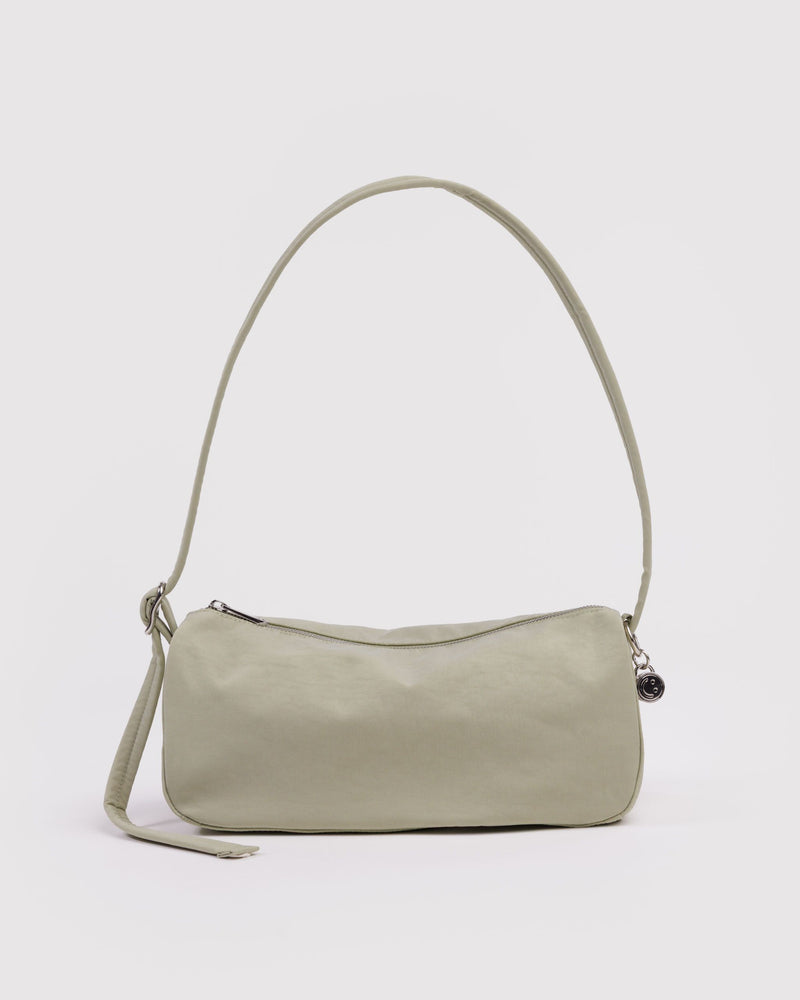 Celadon nylon loaf bag with curved top handle, side strap, and top zipper.