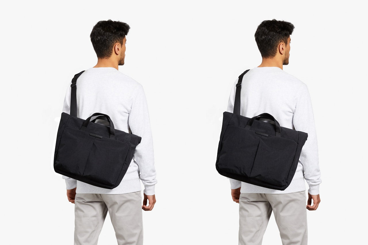 Black messenger bag worn over the shoulder with an adjustable strap.