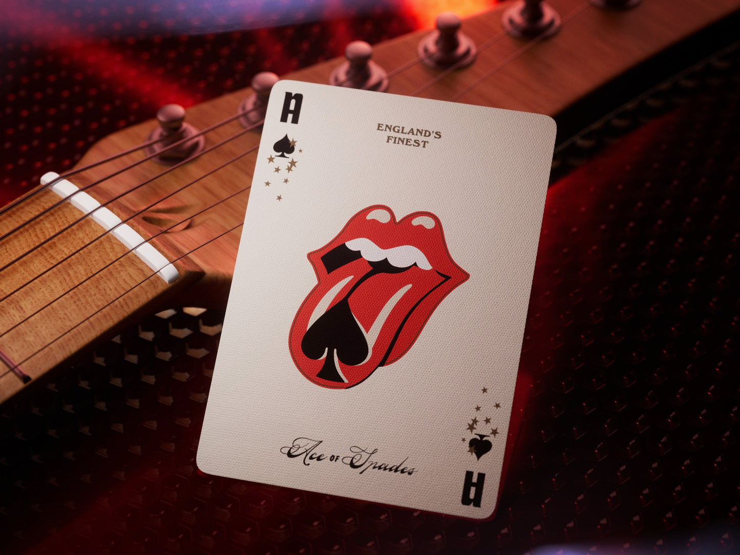 Playing card showing H spade icon and red Rolling Stones lips logo on white