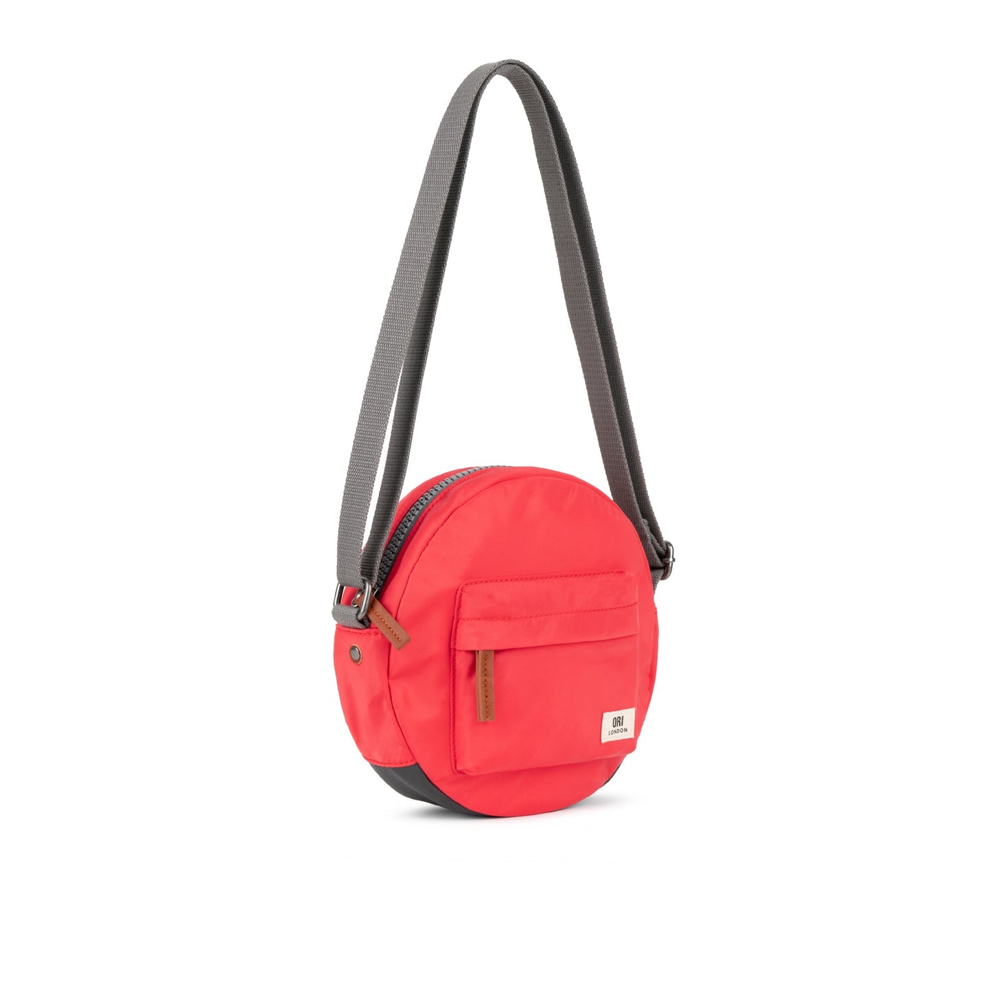 Recycled canvas crossbody bag with red round body and adjustable gray webbing strap