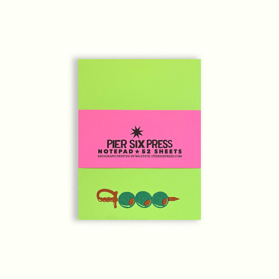 Green and pink notepad cover with star and printed "PIER SIX PRESS" text