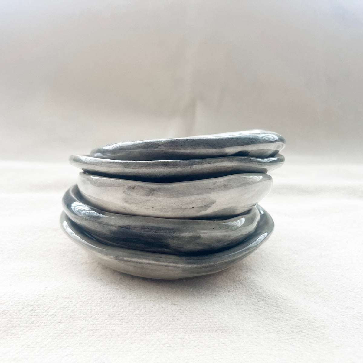 Handmade ceramic trinket dish stack with blue-gray glazed rims