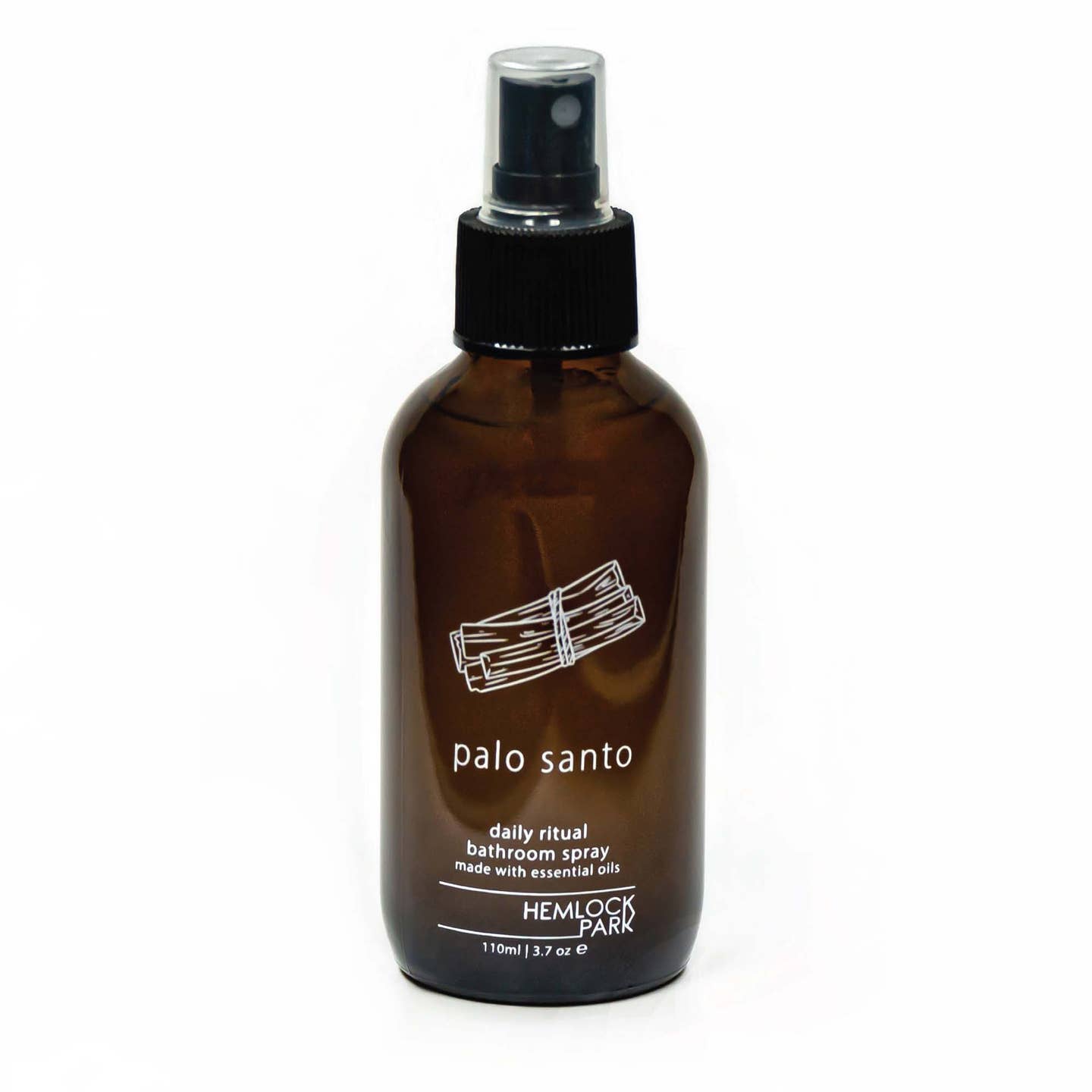 Daily Ritual room spray in amber glass bottle with black mist pump, palo santo label
