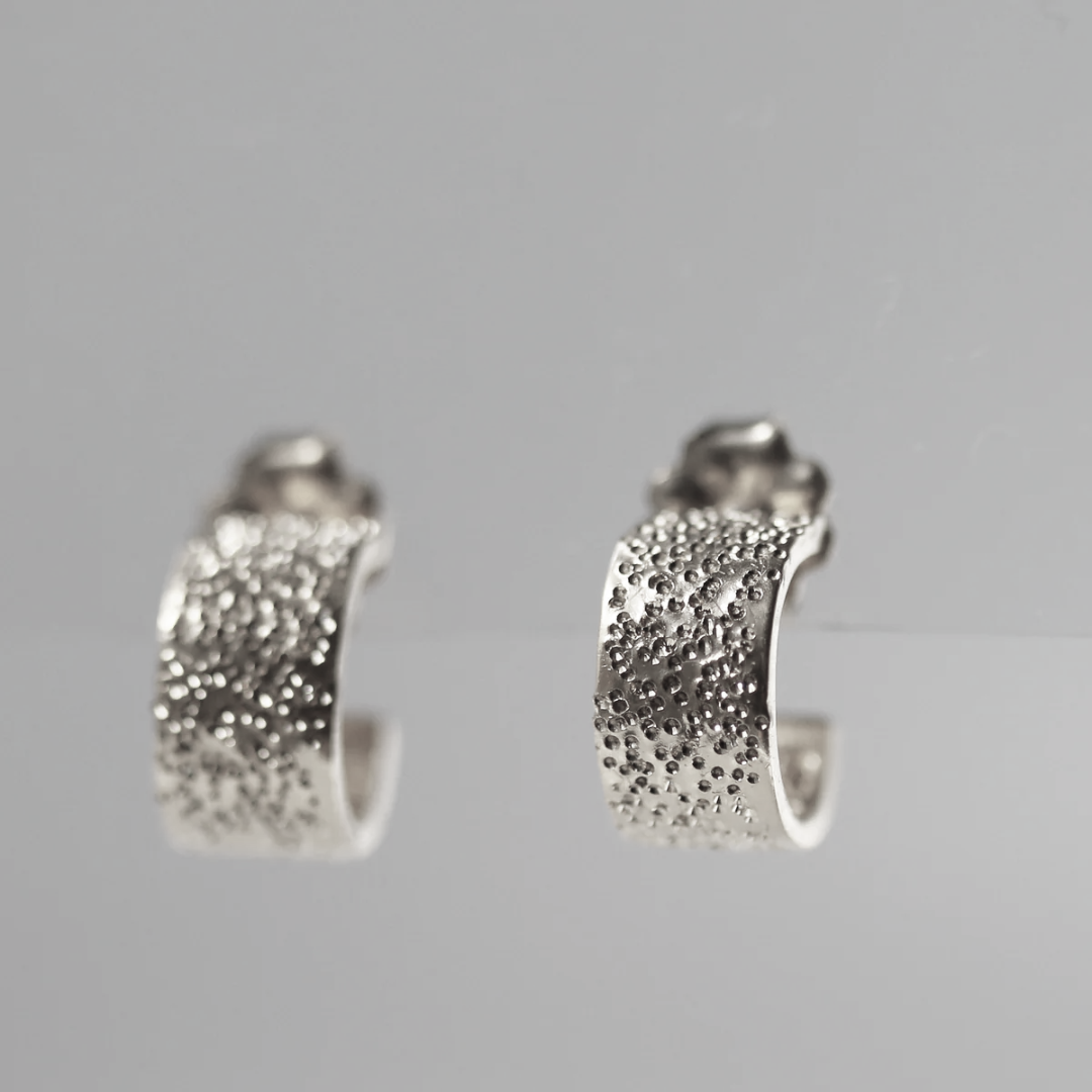 Sterling silver huggie hoop earrings, diamond-dusted textured half-moon