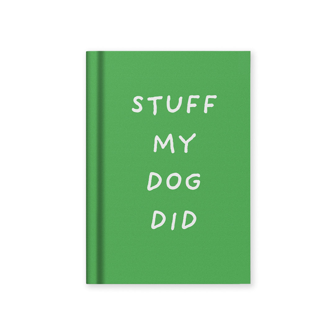 Green hardback fabric notebook with “STUFF MY DOG DID” text on the cover
