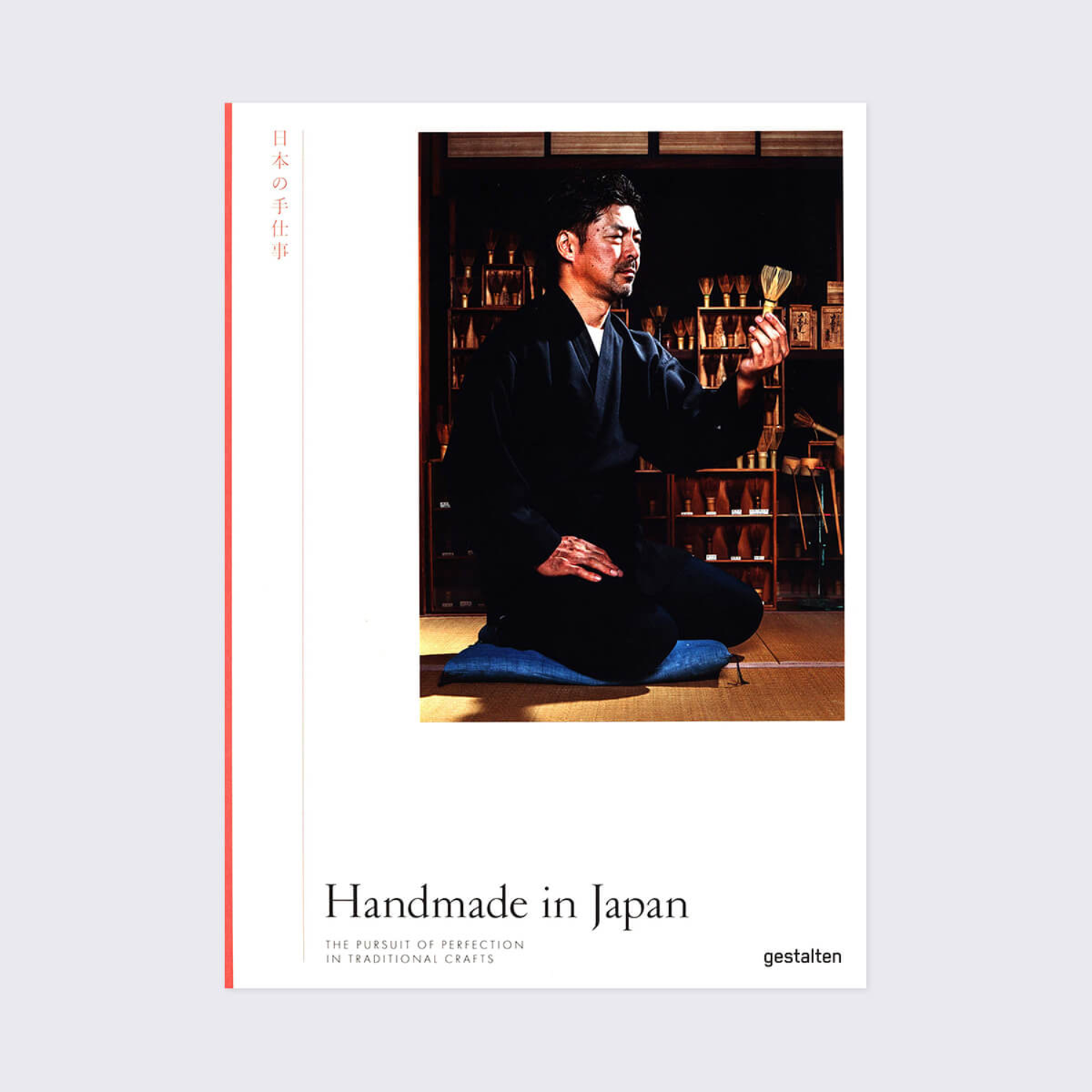 Hardcover book cover with kneeling man in dark robe, blue mat, and title text