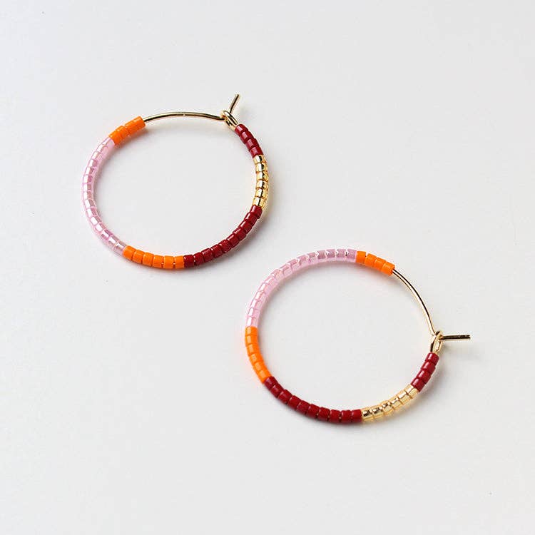 Beaded hoop earrings with pink, orange, and red bead accents