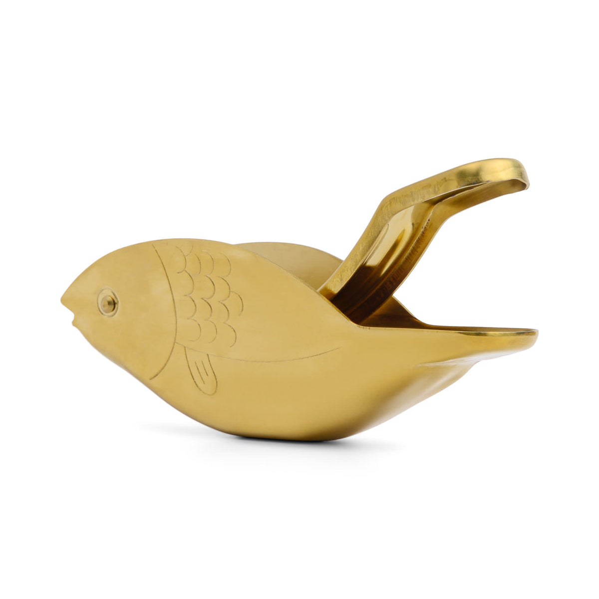 Gold fish-shaped citrus juicer with curved handle and sculpted scales.