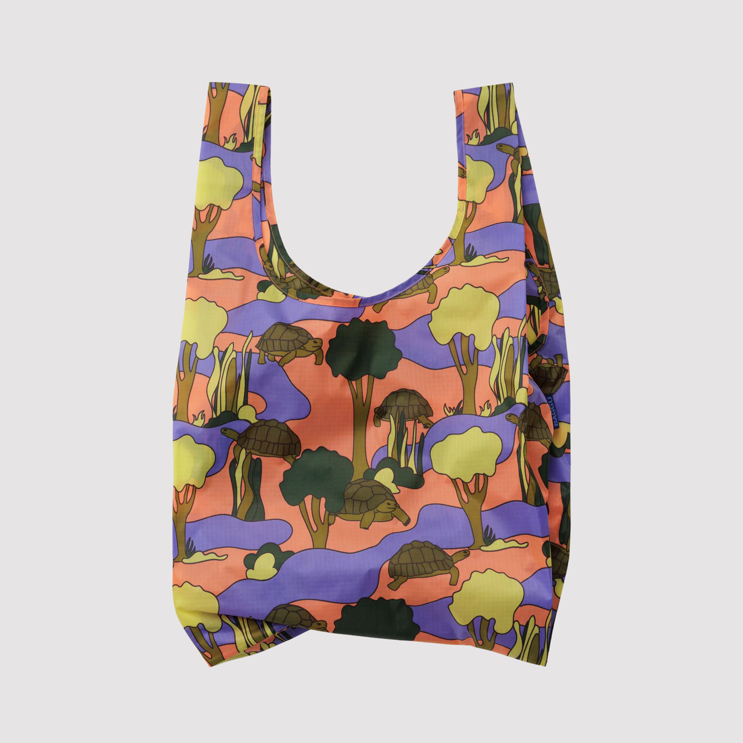 Reusable tote bag with colorful turtle and jungle scene print
