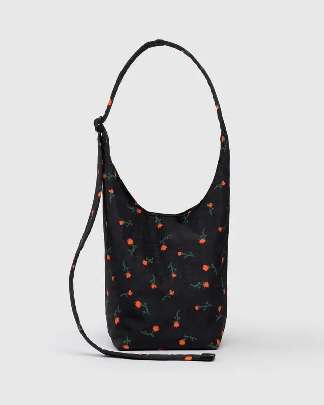 Small nylon sling bag, black with scattered colorful floral print