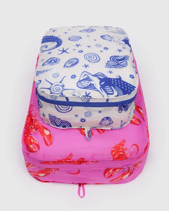 Large packing cube set with blue whale doodle print and pink base, zipped top