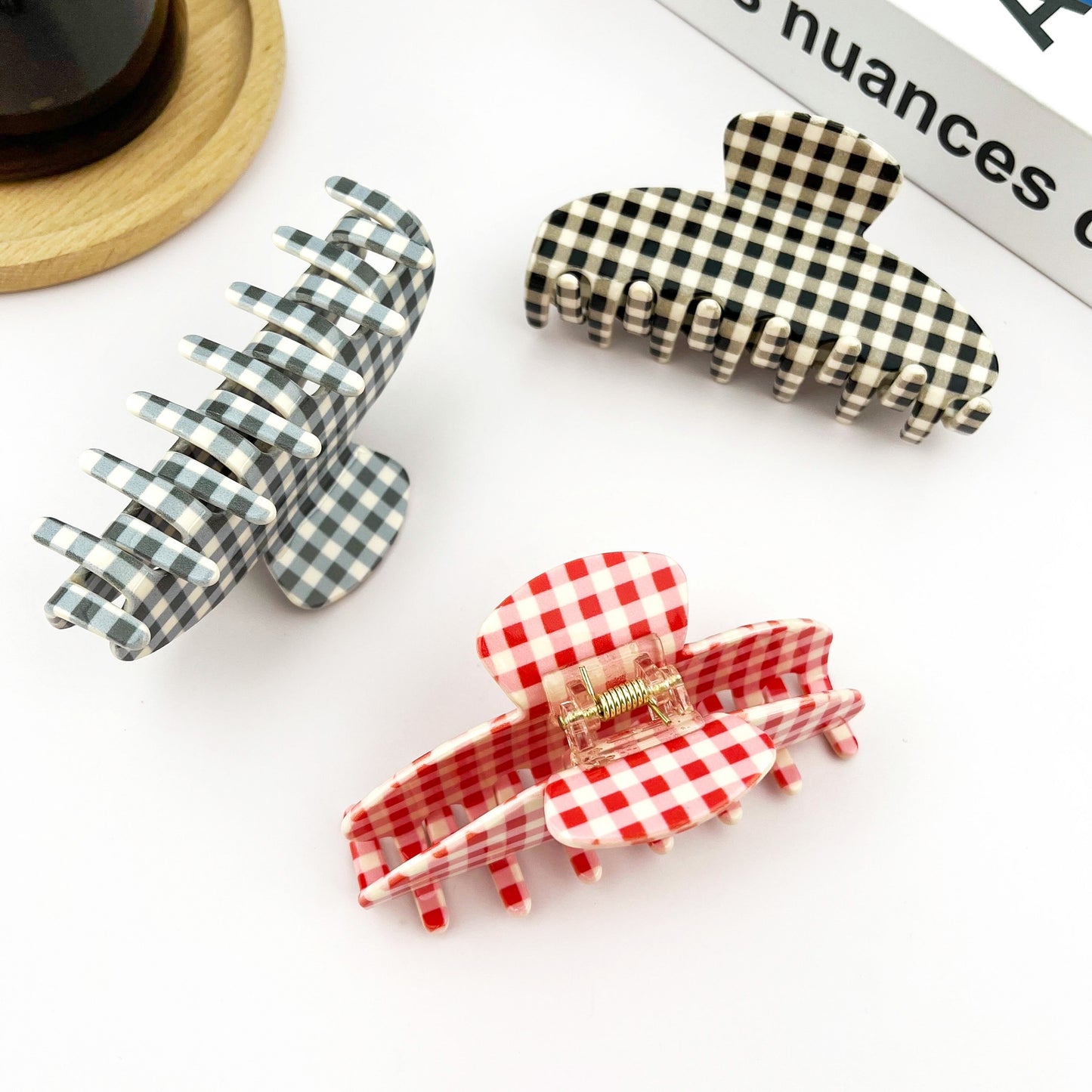 Assorted checkered acetate hair claw clips in black and red