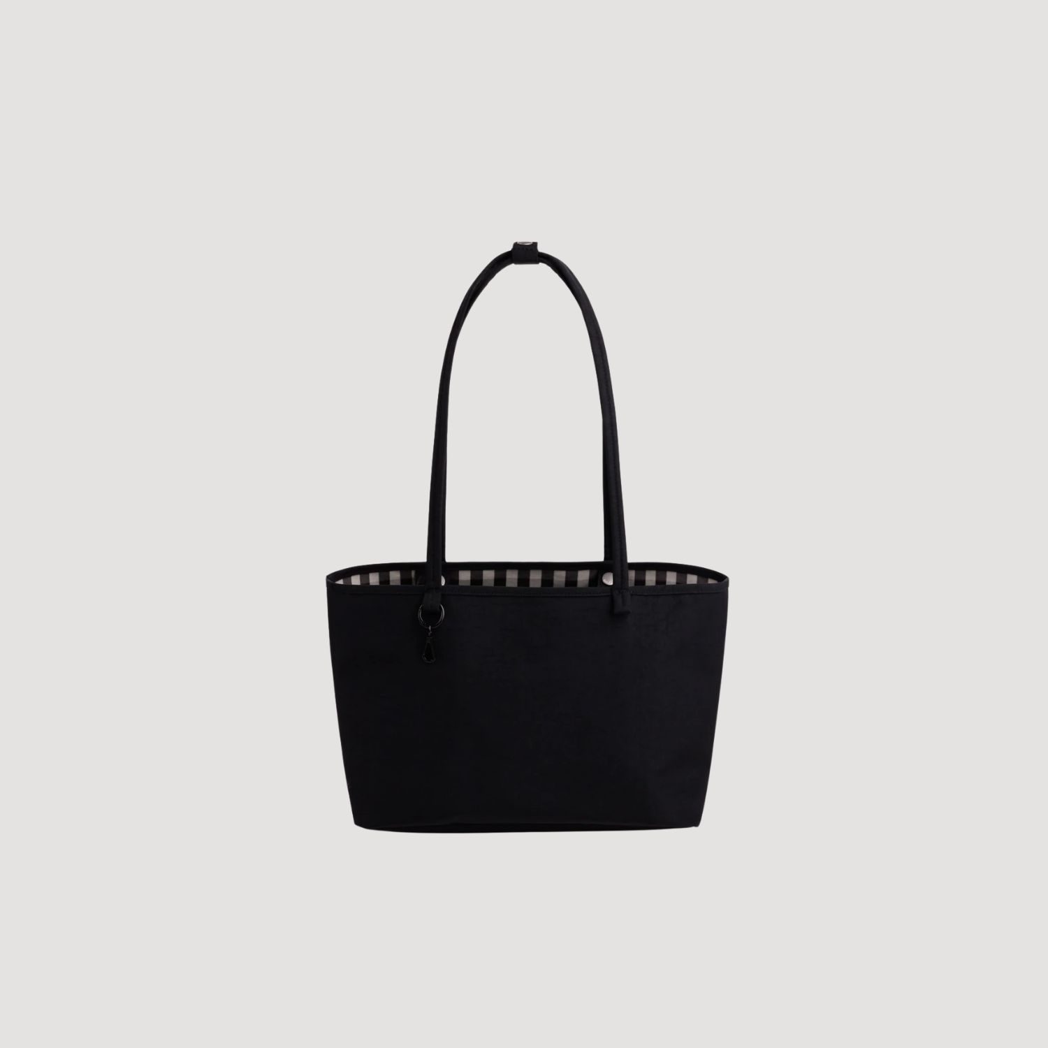 Medium reversible nylon tote with top handles and zip closure, black.