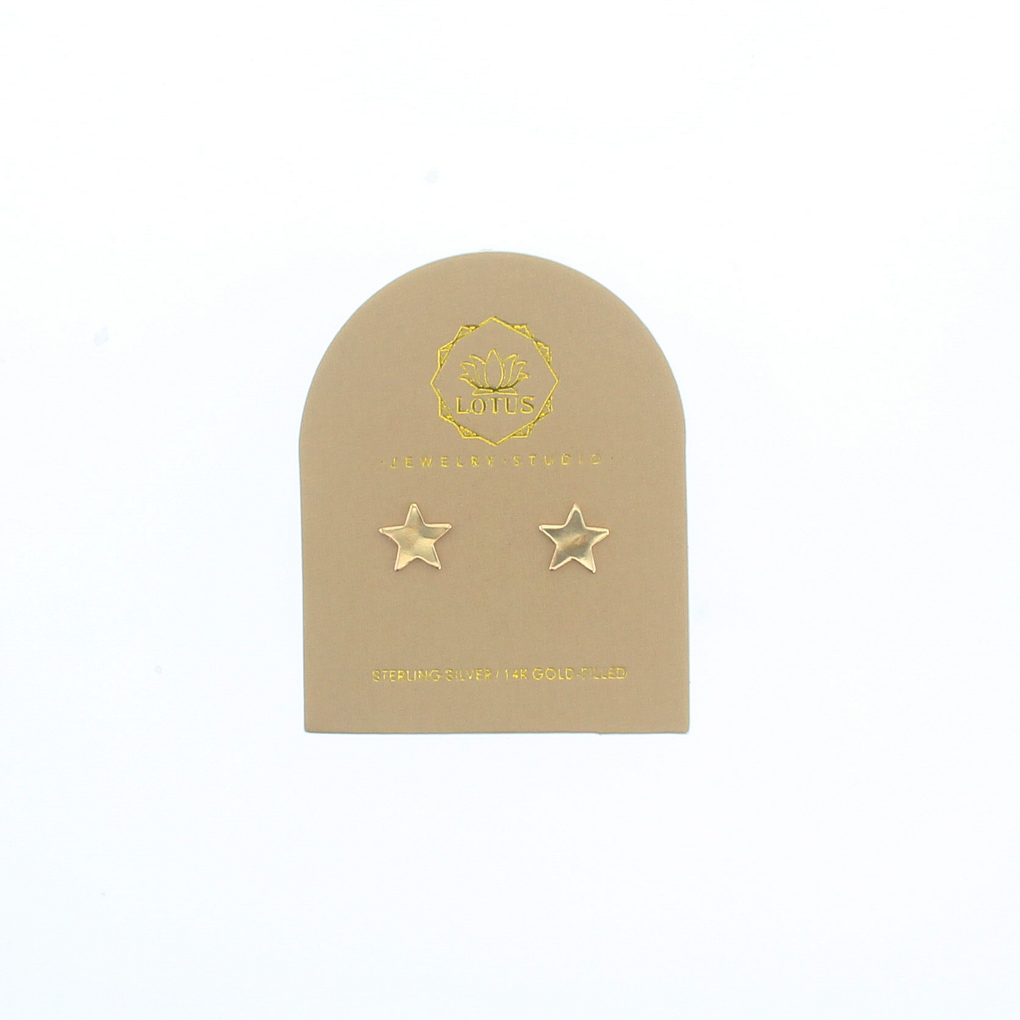 Gold star stud earrings on beige display card with two star studs