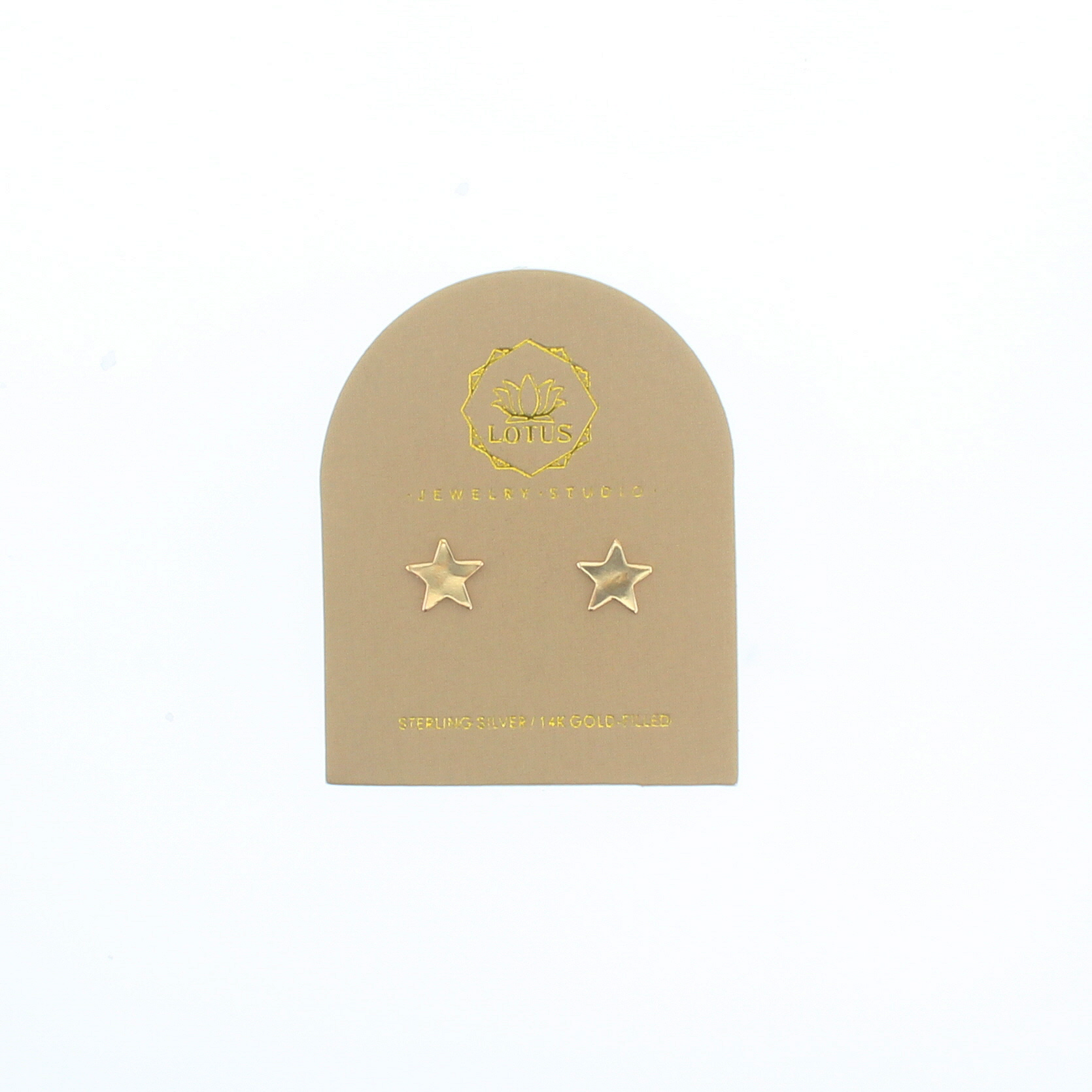 Gold star stud earrings on beige display card with two star studs