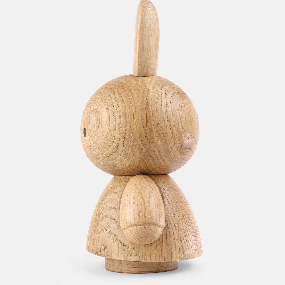 Mini oak wood bunny figurine with carved back texture and long upright ears
