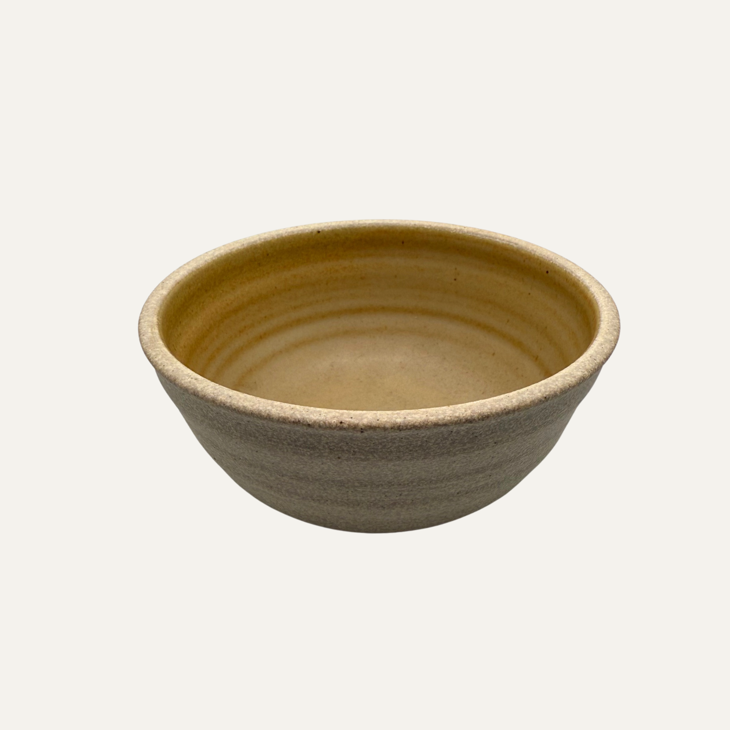 Small matte glazed bowl with goldenrod interior and dark gray exterior