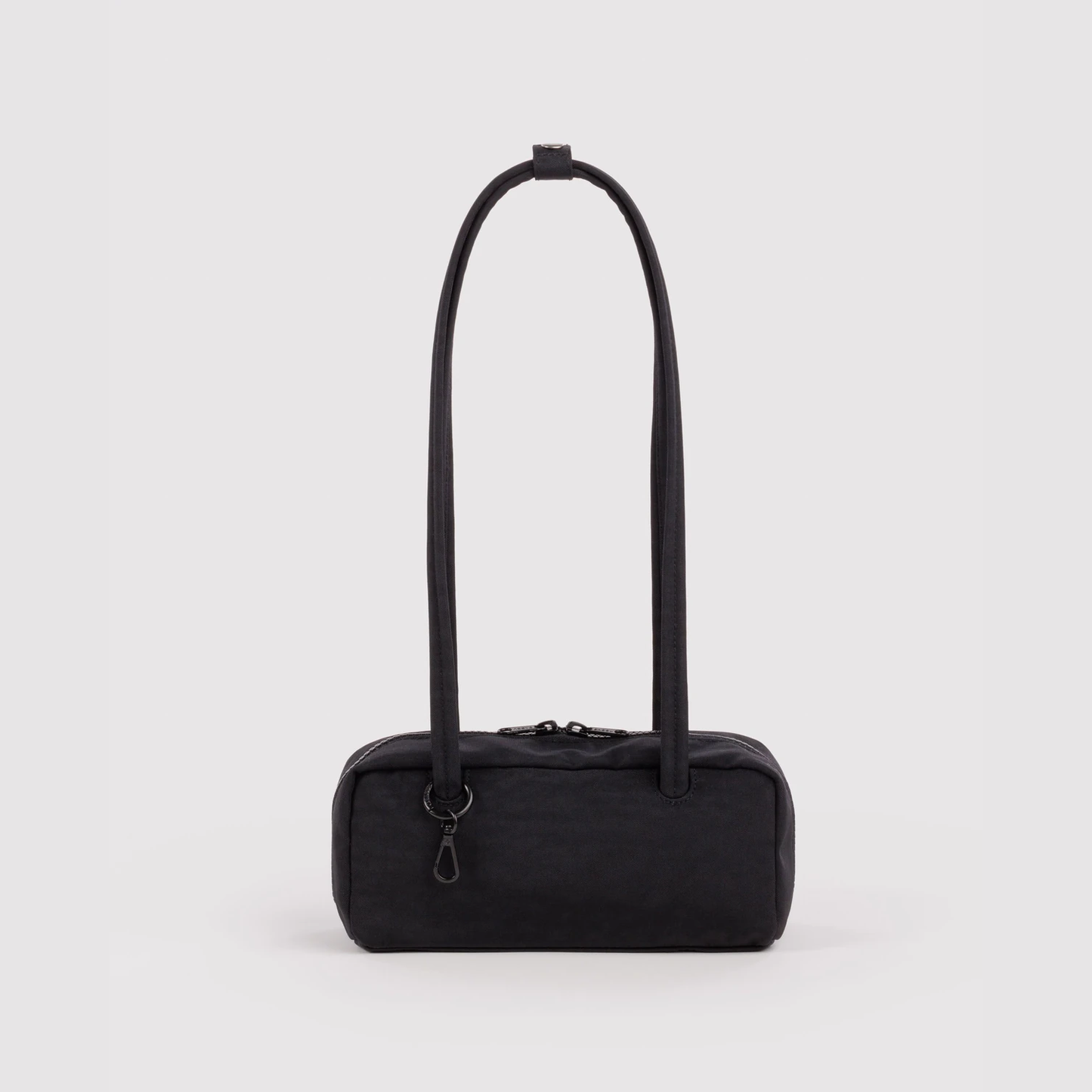 Small nylon bowler bag in black, top handles and front zip pocket.