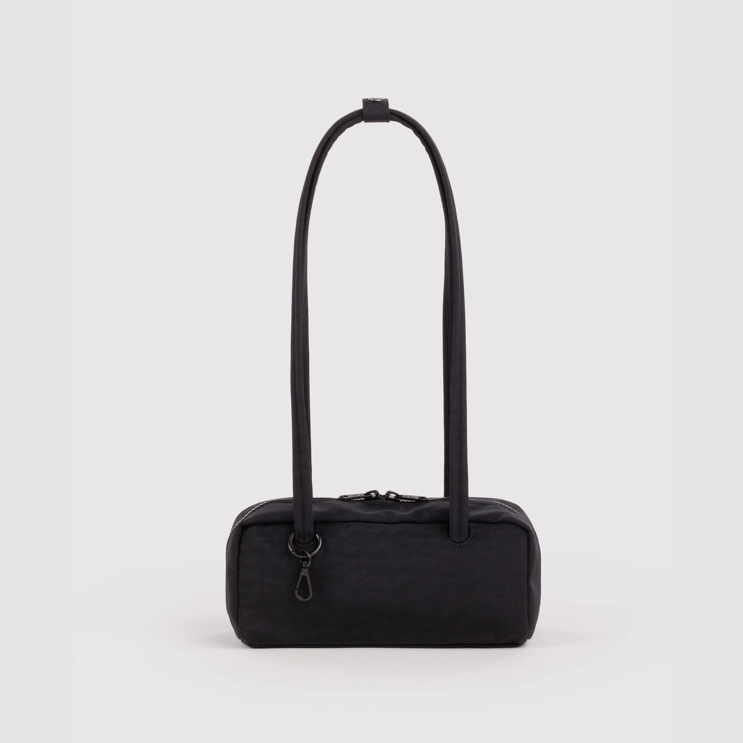 Small nylon bowler bag in black, top handles and front zip pocket.