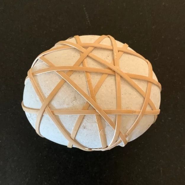 Medium decorative wrapped rock with pale cane lattice and light white center