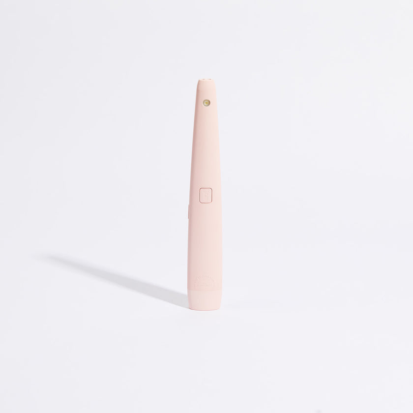 Pink USB rechargeable lighter with round top button and side charging panel