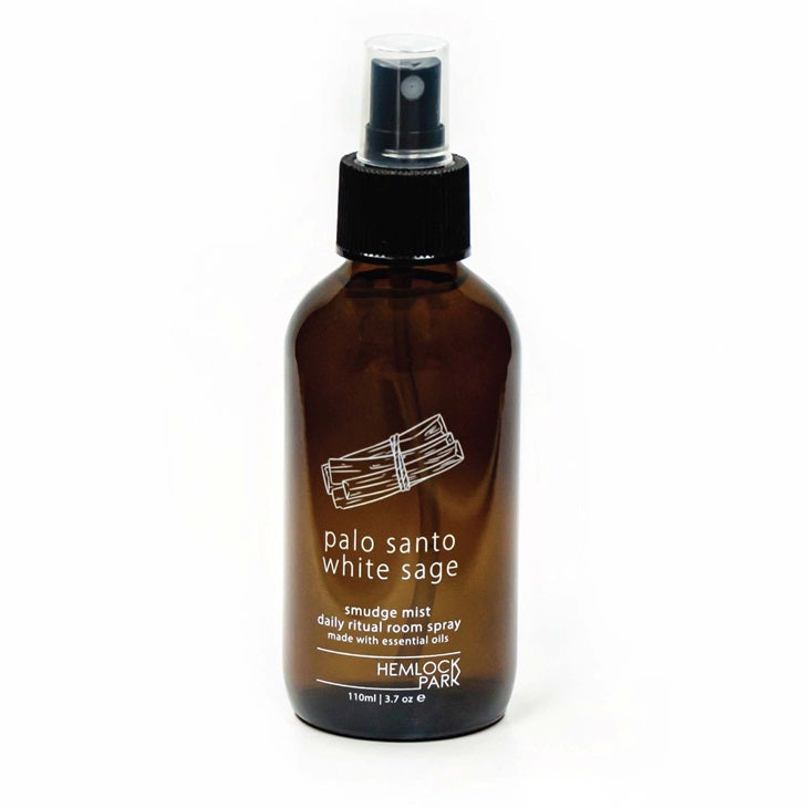 Palo santo & white sage smudge spray in amber bottle with black pump sprayer