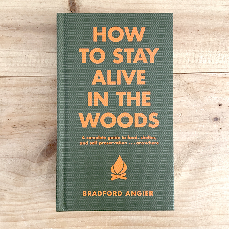 Survival guide book with green cover and orange title text