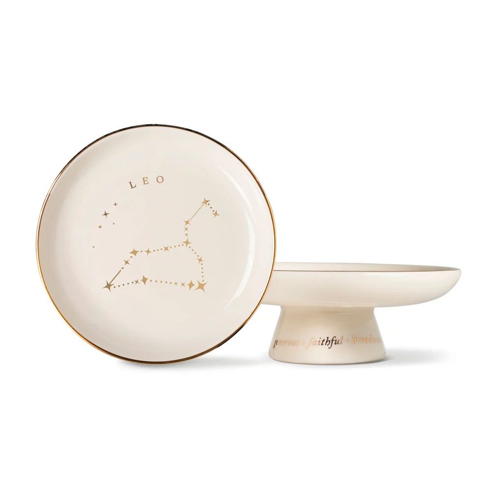 Round cream pedestal tray with gold edge, shallow dish, Leo star sign constellation