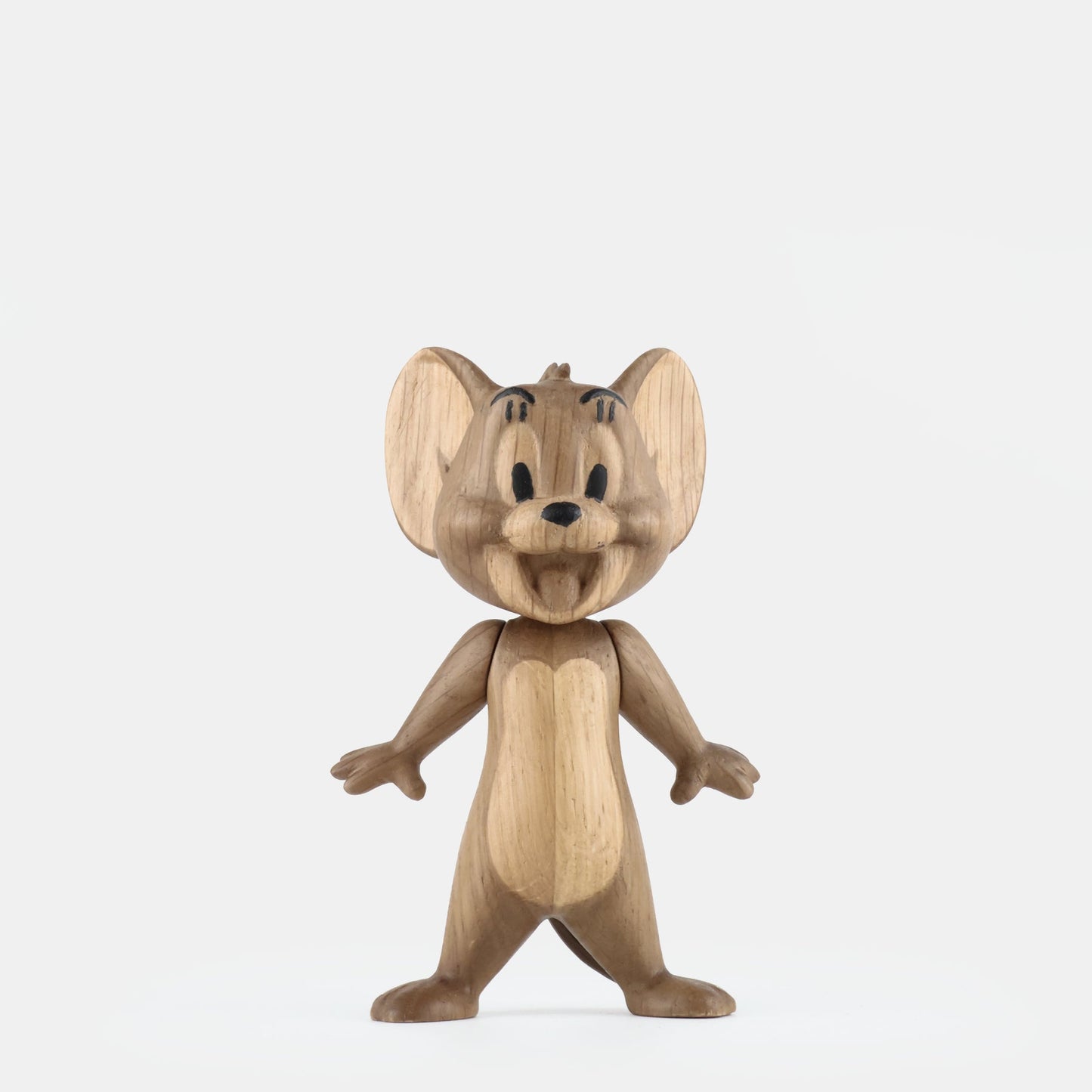 Small smoked oak figurine, front view with blue-toned face markings and arms open