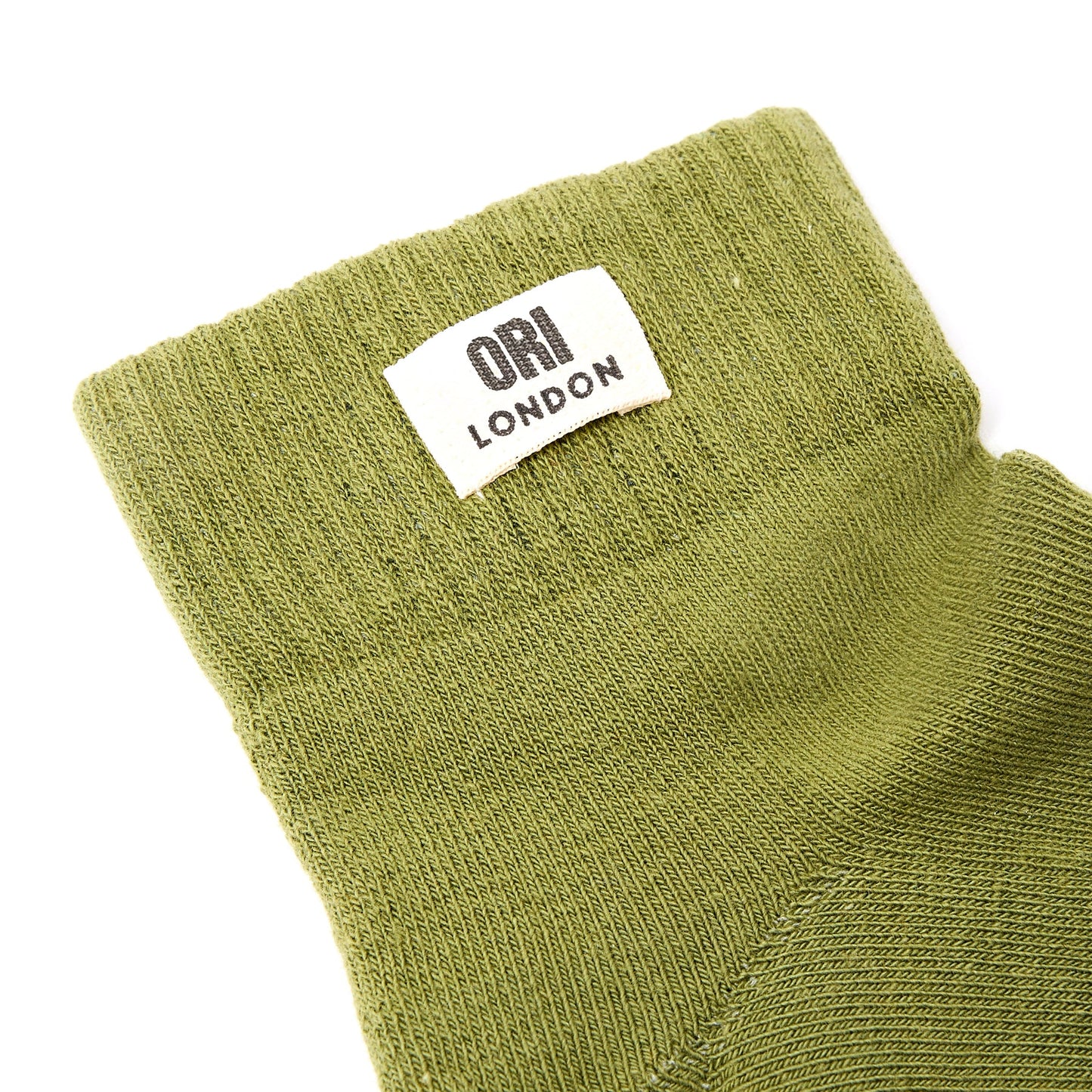 Men's avocado green ankle socks with ORI LONDON logo patch on cuff.