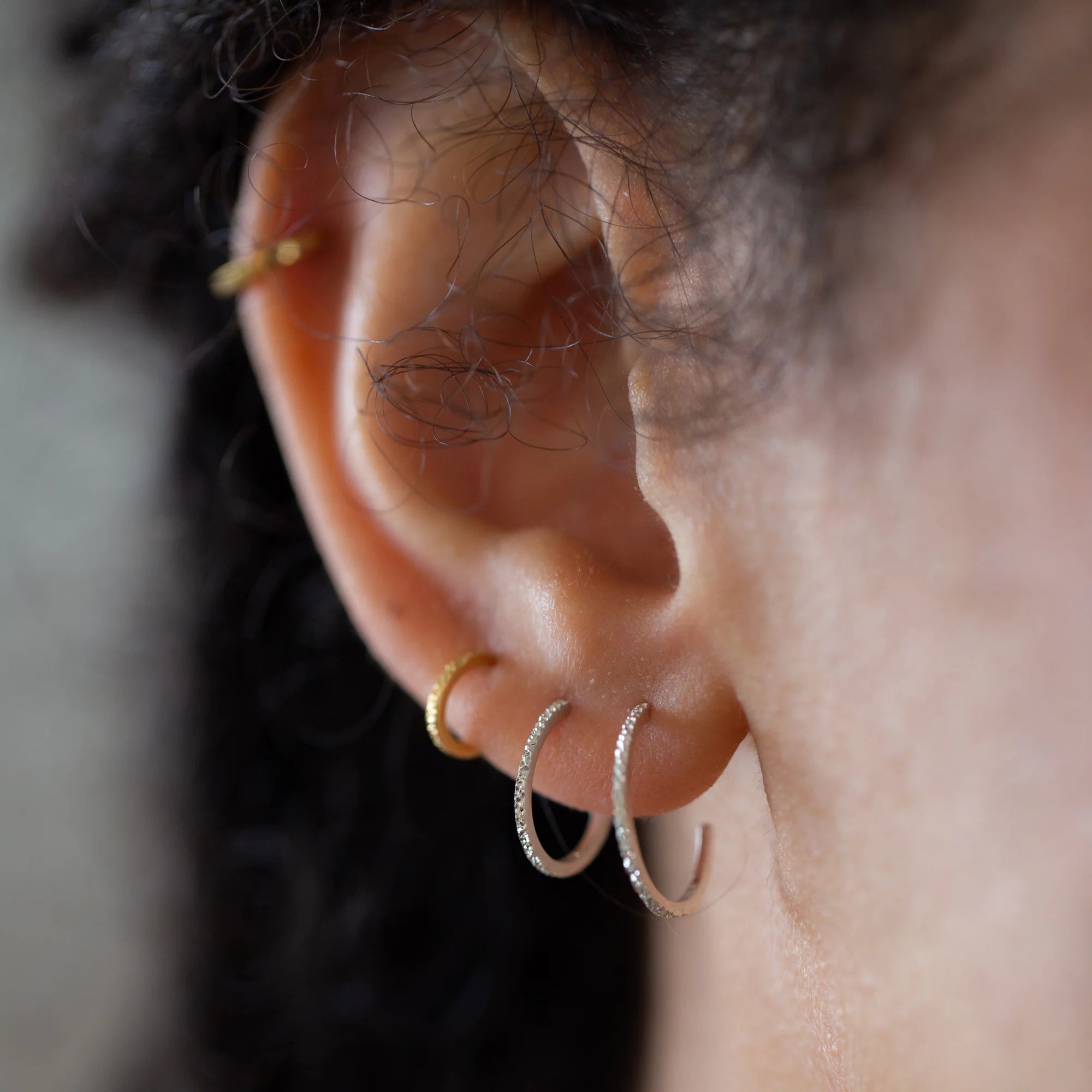 Diamond-dusted huggie hoop earrings with gold and silver-tone rings