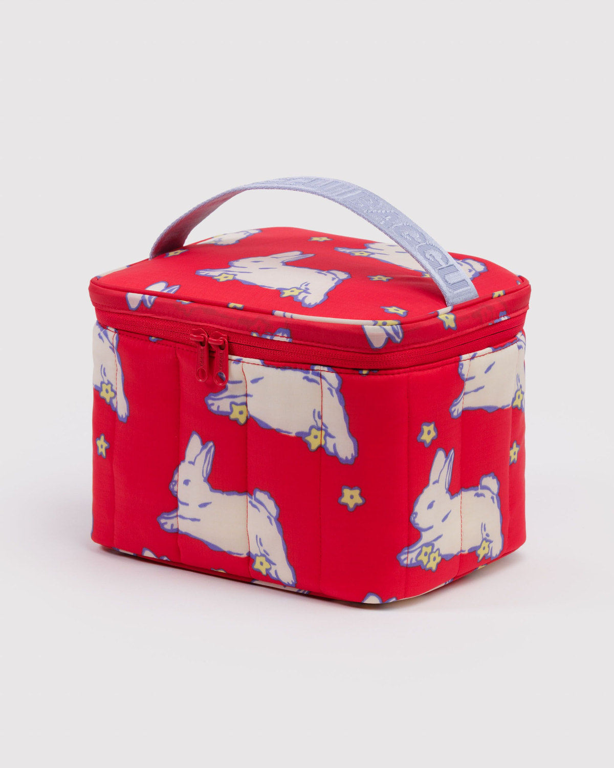 Puffy lunch bag in red with white bunny pattern, black zipper and handle