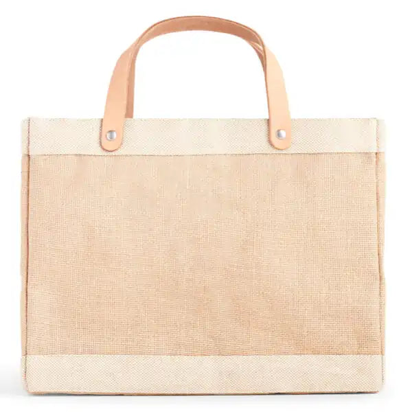 Homage petite market bag front view, natural canvas with top handles and light trim.