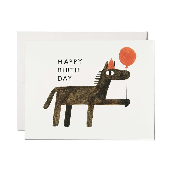 Birthday card: dog holding orange balloon with 'HAPPY BIRTHDAY' message