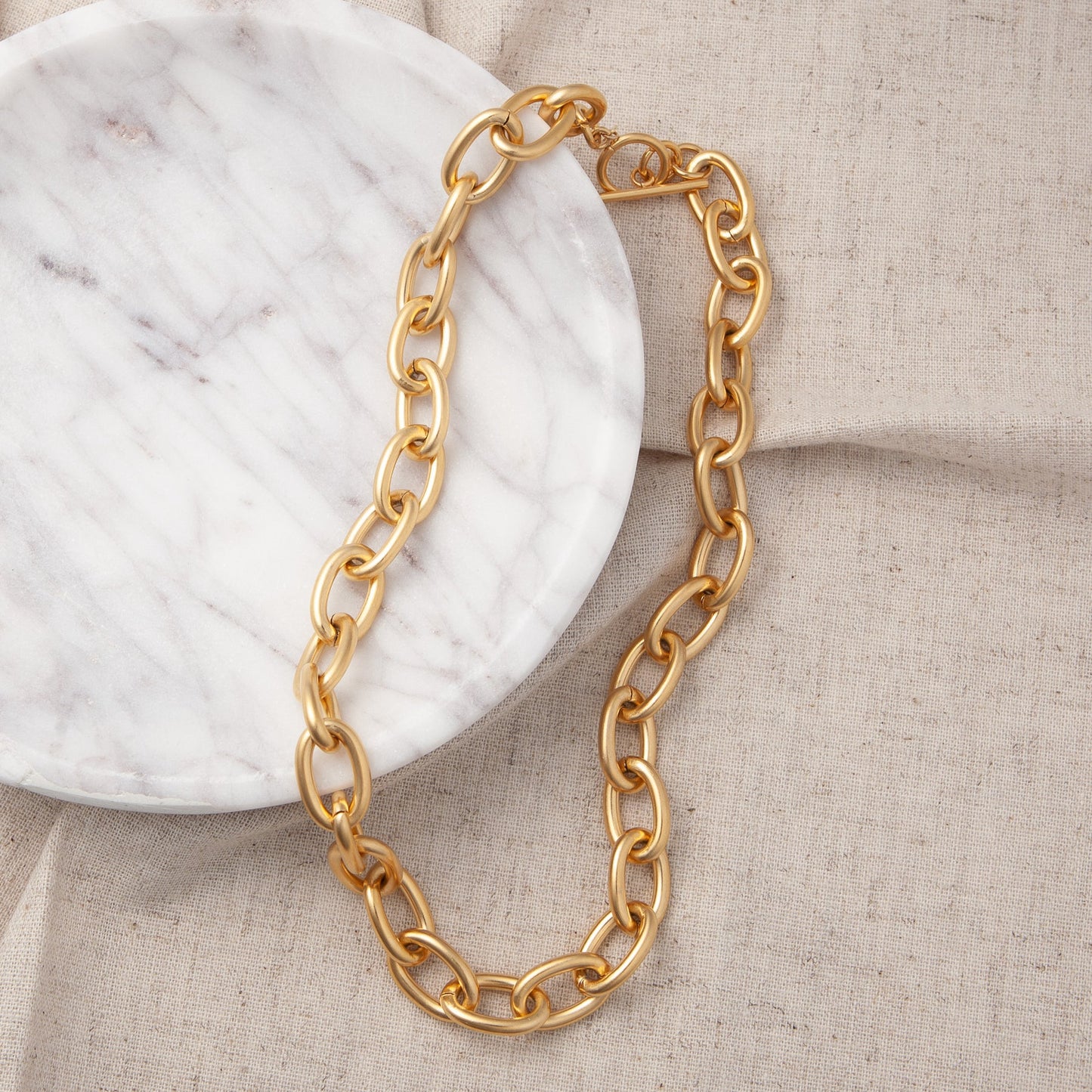 Gold-tone oval link chain necklace with clasp at back