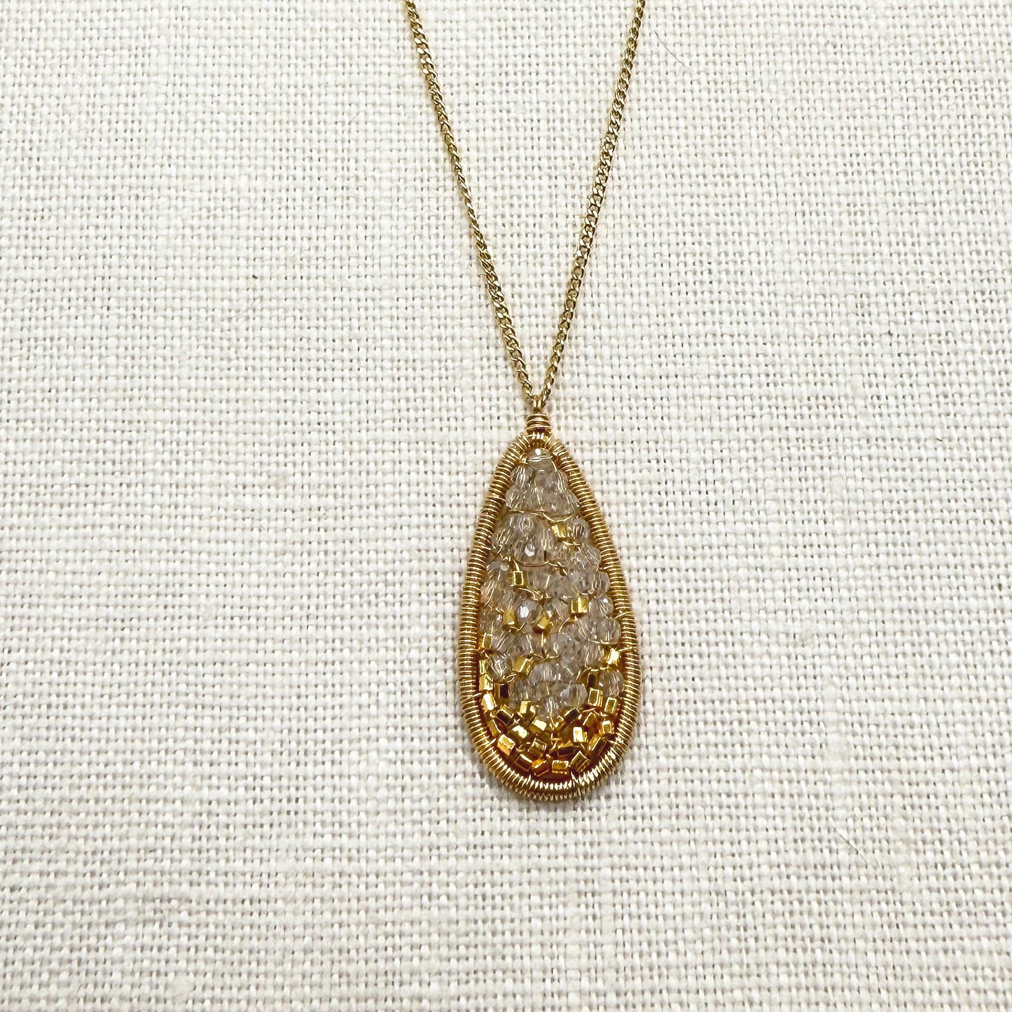 Gold wirework oval crystal mosaic pendant on fine chain