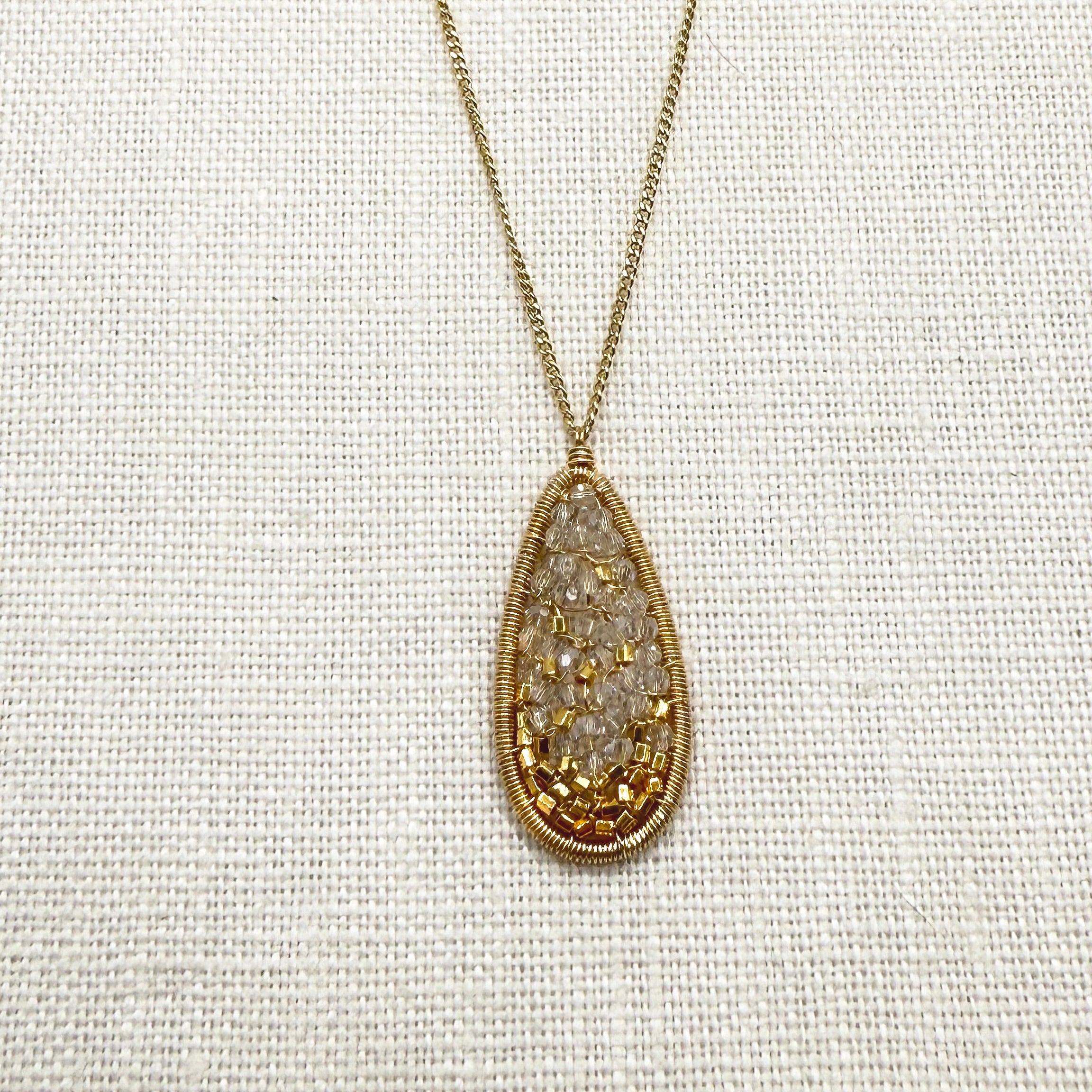 Gold wirework oval crystal mosaic pendant on fine chain