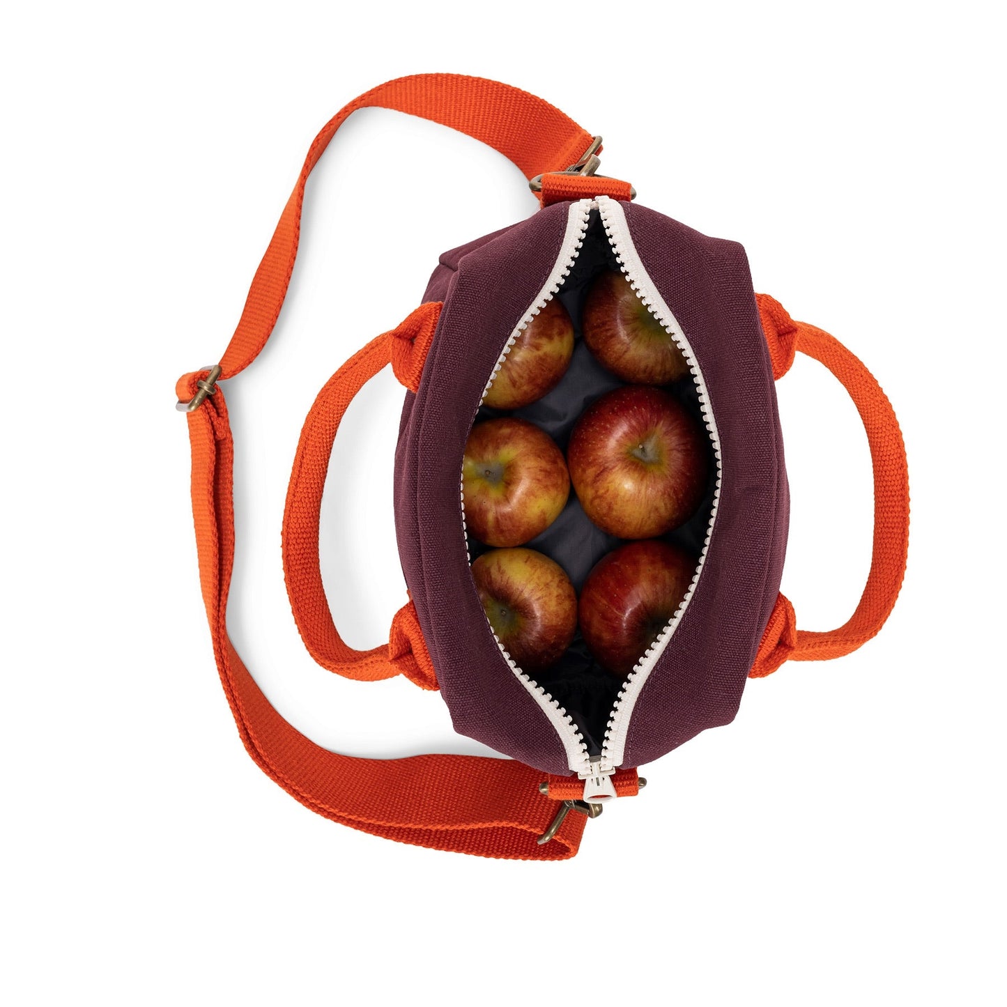 Lunch clutch bag in fig purple, open zipper with apples inside and orange straps