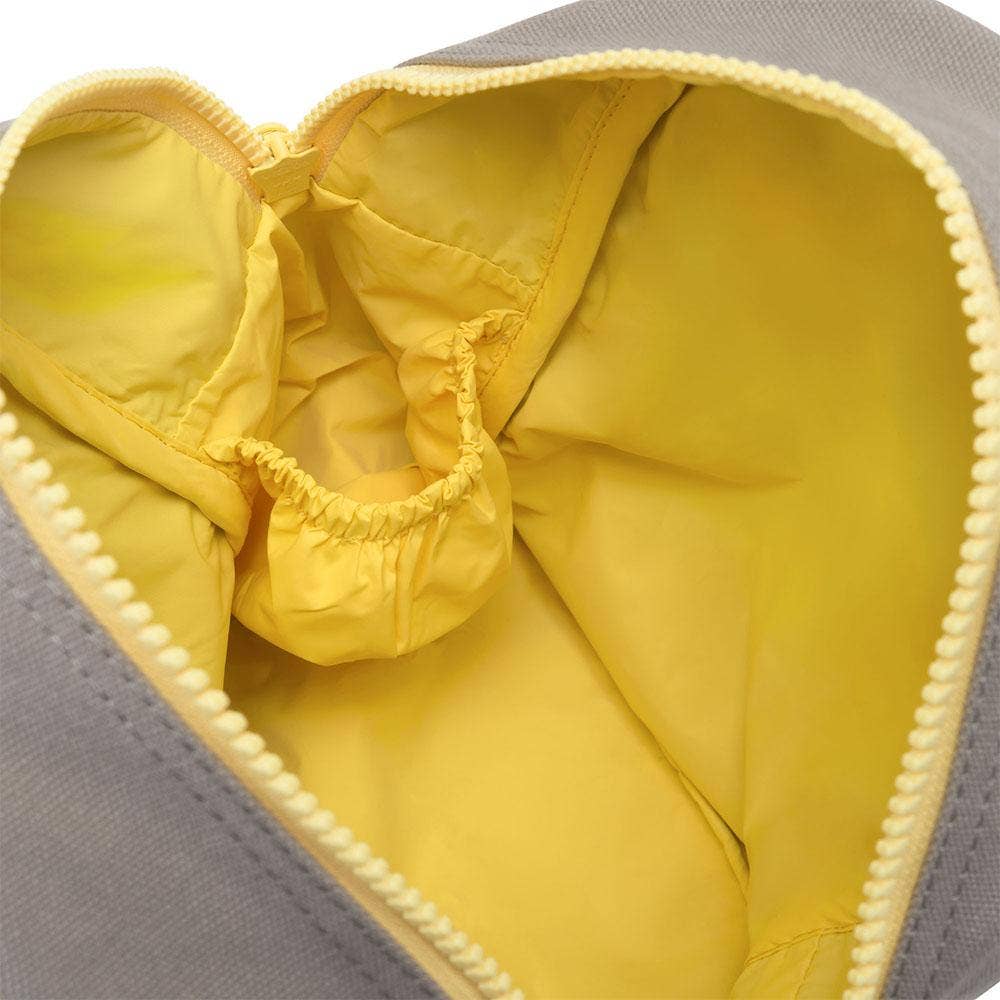 Zipper lunch bag interior view with yellow lining and gathered fabric at the open top